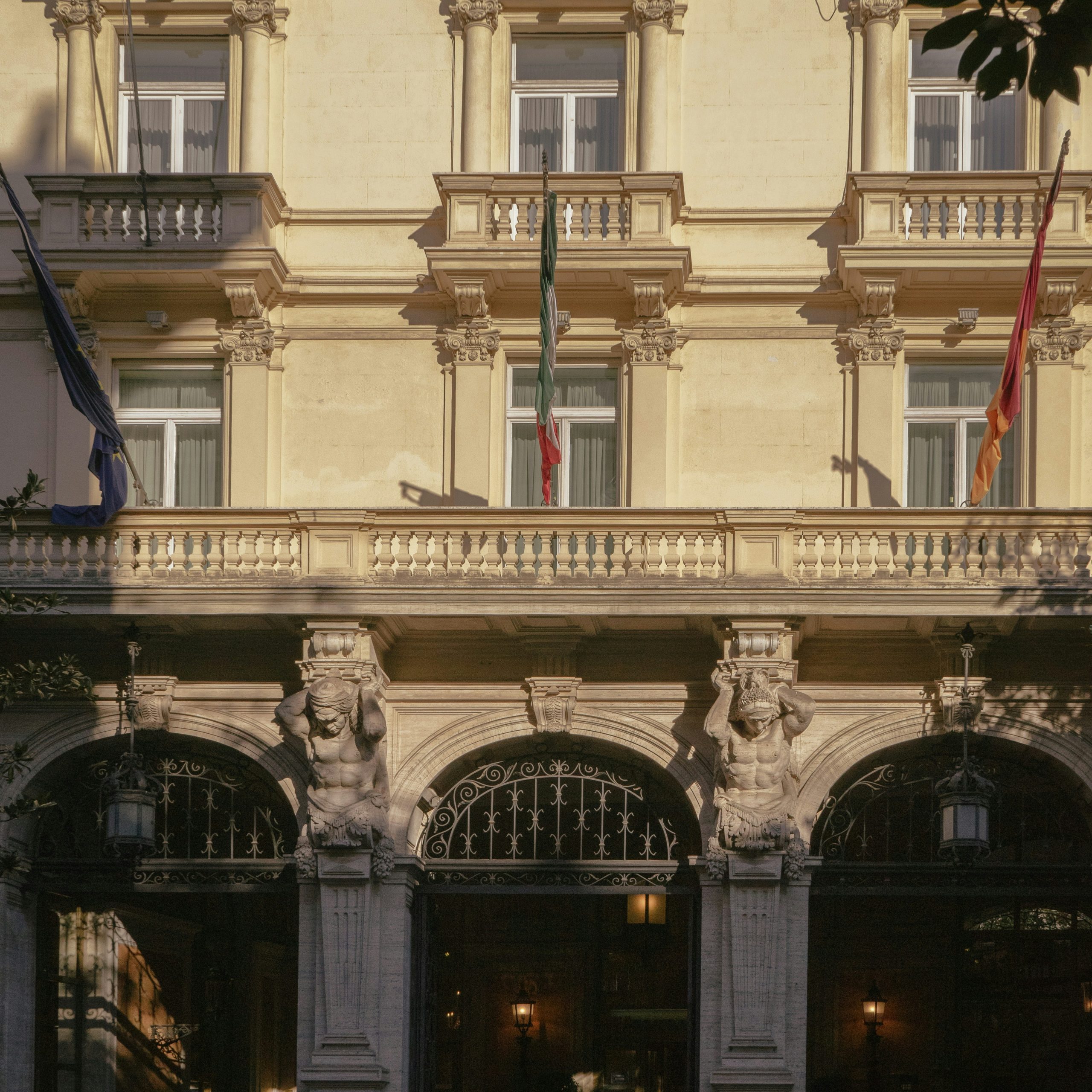 a car parked in front of a tall building